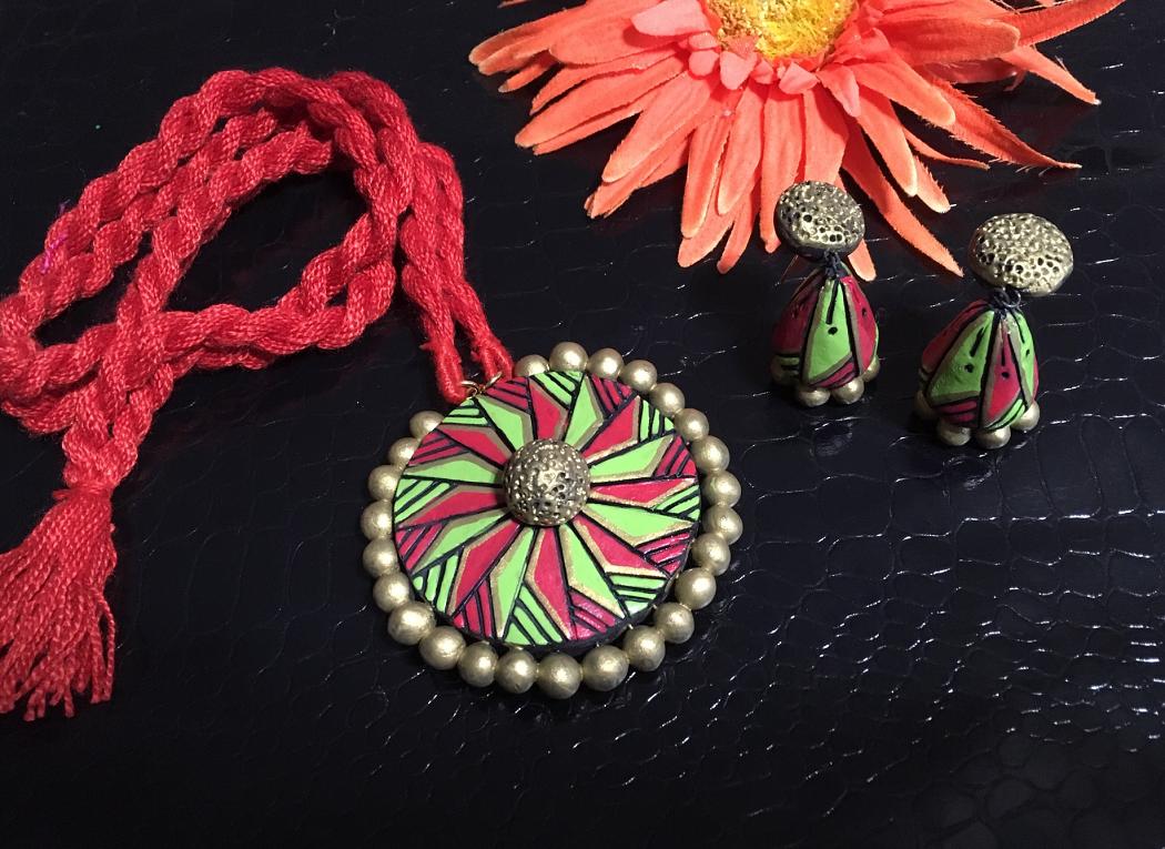 Green and Red Terracotta pendant and Jhumka in a long thread rope-!!! Green and Red Terracotta pendant and Jhumka in a long thread rope-!!!