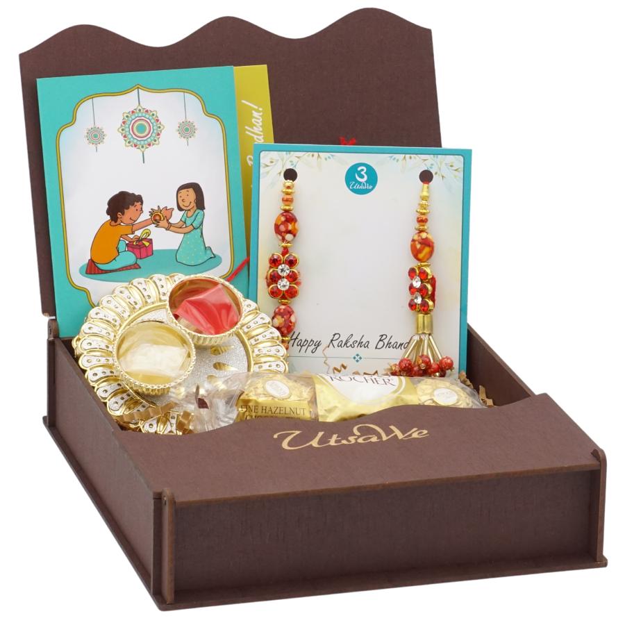 Lumba Bhaiya Bhabhi Red Kundan Rakhi Set w/ Roli,Chaval,Chocolate & Card Lumba Bhaiya Bhabhi Red Kundan Rakhi Set w/ Roli,Chaval,Chocolate & Card