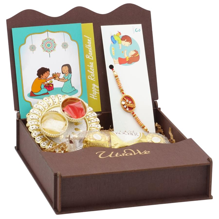 UtsaWe GIFT HAMPER - Blissful Rakhi W/ Ruby Like Stone Surrounded W/ Beads UtsaWe GIFT HAMPER - Blissful Rakhi W/ Ruby Like Stone Surrounded W/ Beads