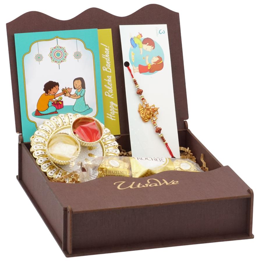 Divine Gift Hamper W/ Shubh Laxmi Ji Rakhi + Roli, Chaval, Card, Chocolates Divine Gift Hamper W/ Shubh Laxmi Ji Rakhi + Roli, Chaval, Card, Chocolates