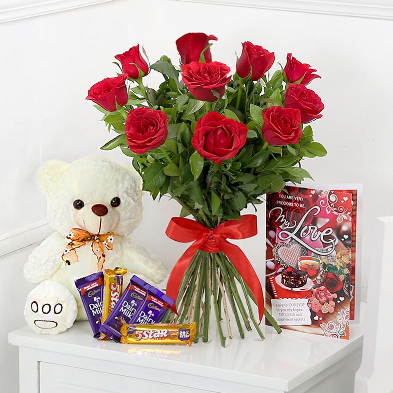 teddy bear with chocolate and roses