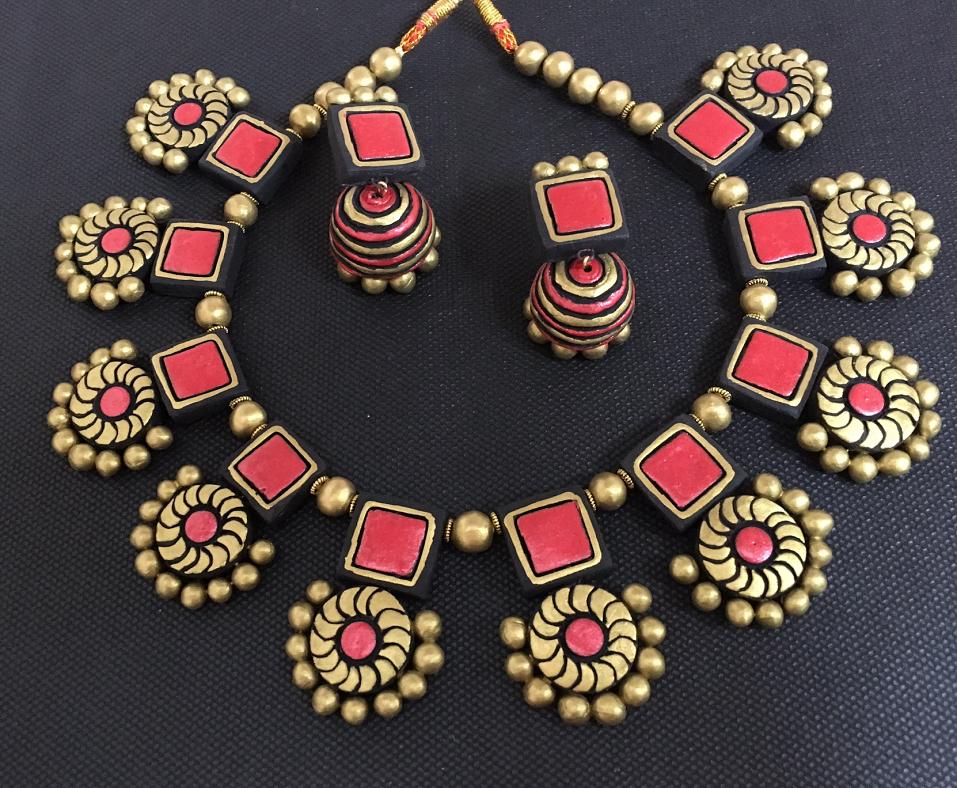 black metal jhumkas and necklace