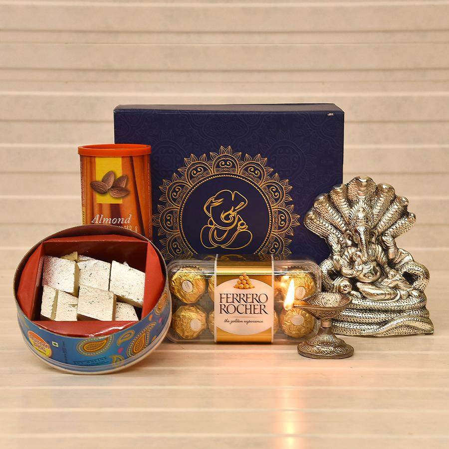 Sarp Ganesha Idol with Diya, Roasted Almonds, Chocolates & Kaju Katli