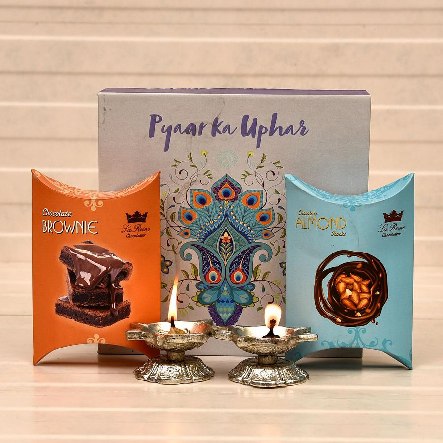 White Metal Set of 2 Diyas with Pack of Chocolate Almond & Brownies