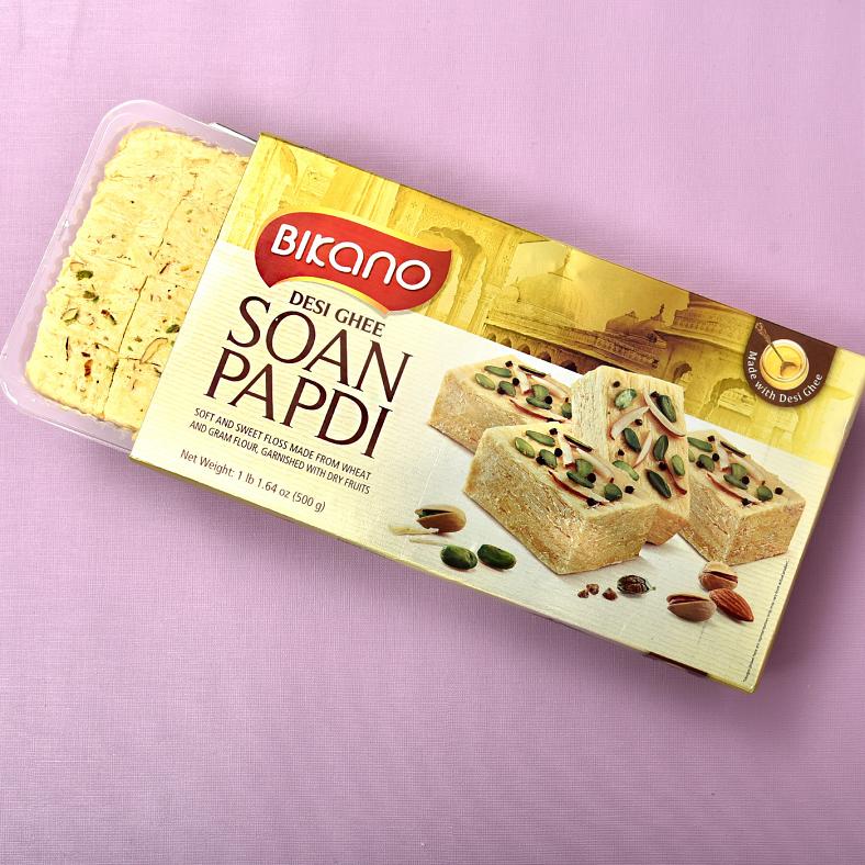 Fancy Om Dial Rakhi Set of 2 with Soan Papdi