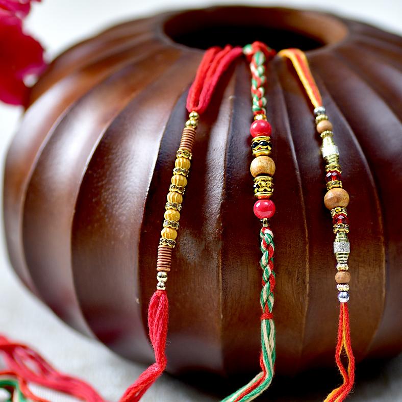 Appealing Bead & Stone Studded Rakhi Set of Three