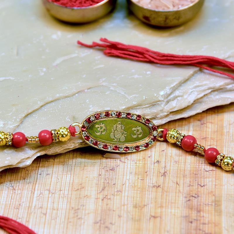 Om Ganesha Metallic Rakhi with Beads 43365 Buy Send Rakhi To India