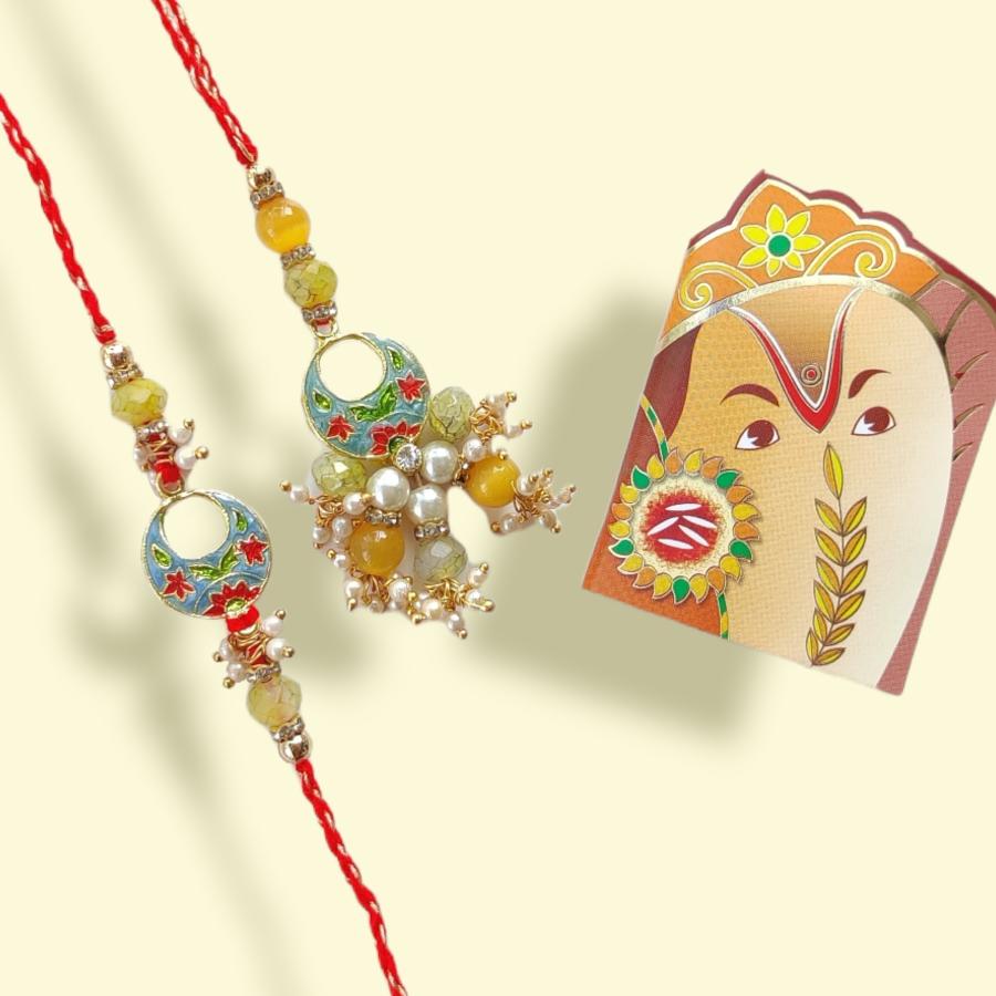 Mina Lumba Rakhi With Polished Crystal Tassel + Roli & Chaval Mina Lumba Rakhi With Polished Crystal Tassel + Roli & Chaval