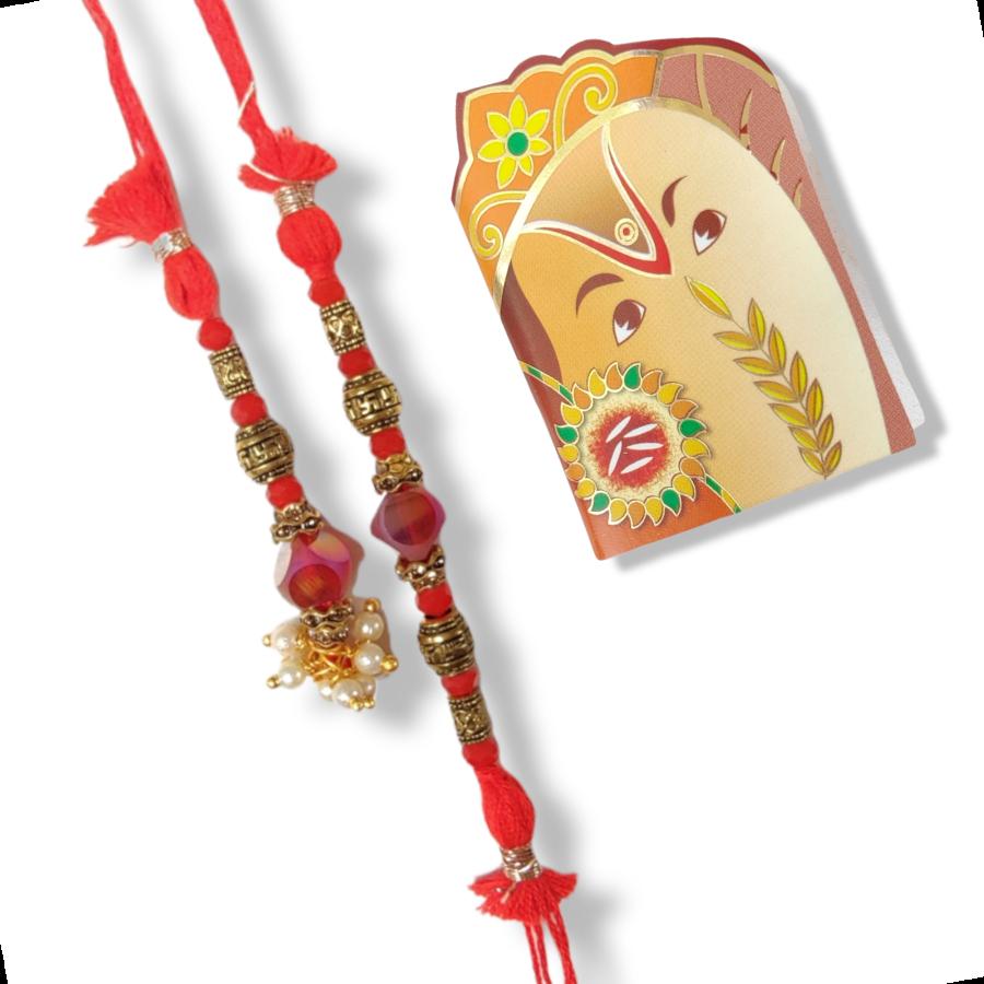 Red Crystal Lumba Rakhi With Antique Beads + Roli & Chaval Red Crystal Lumba Rakhi With Antique Beads + Roli & Chaval