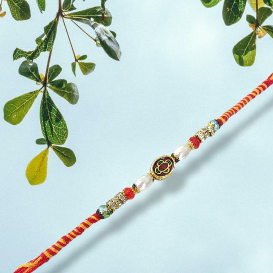 Cute Mina Rakhi With Handcrafted Ornaments + Roli & Chaval Cute Mina Rakhi With Handcrafted Ornaments + Roli & Chaval