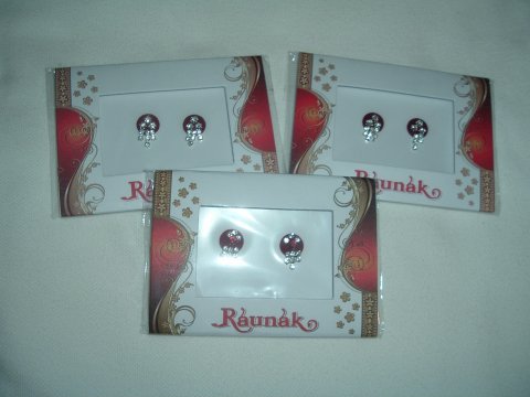Round maroon fancy bindis with clear stones