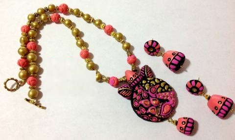 Lovely peacock pendant Set with matching Jhumkas-Pink and Orange Lovely peacock pendant Set with matching Jhumkas-Pink and Orange