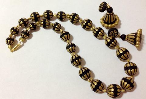 Hand Carved Black & Gold Necklace & Jhumka with Intricate Design Hand Carved Black & Gold Necklace & Jhumka with Intricate Design