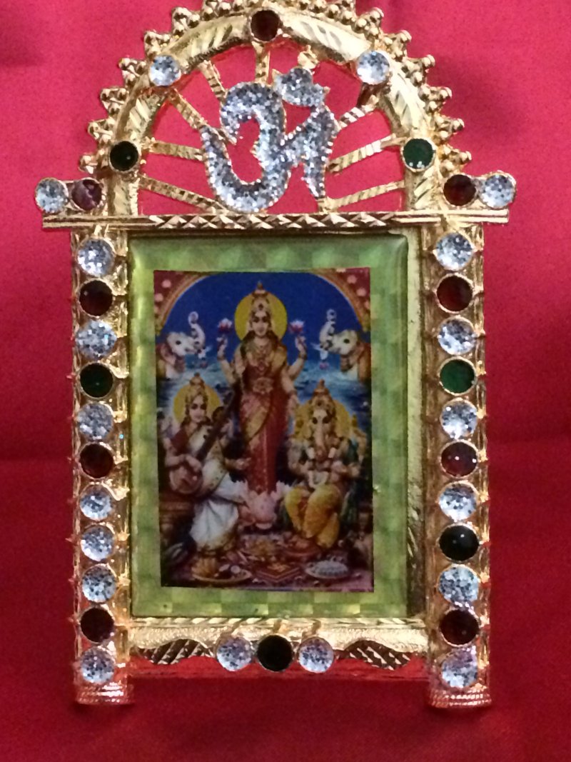 Gold Stone Work Photo Frame of Ganesh, Lakshmi & Saraswati Gold Stone Work Photo Frame of Ganesh, Lakshmi & Saraswati