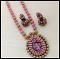 Pink & Orange Tear Drop Peacock Pendant Set with Jhumkas Pink & Orange Tear Drop Peacock Pendant Set with Jhumkas