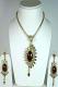 Maroon and Golden Color Stone Studded Pendant Set Maroon and Golden Color Stone Studded Pendant Set