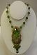 Green enamel & stone gold plated pendant set