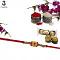 Premium Gold Pended Rakhi W/ Radiant Ruby Embellishment + Roli & Chaval Premium Gold Pended Rakhi W/ Radiant Ruby Embellishment + Roli & Chaval
