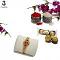 Designer Rudraksh Rakhi With Gold & Silver Band W/ Crysrals + Roli & Chaval Designer Rudraksh Rakhi With Gold & Silver Band W/ Crysrals + Roli & Chaval