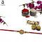 Designer Swastika Rakhi with Amber Diamonds and Peals + Roli & Chaval Designer Swastika Rakhi with Amber Diamonds and Peals + Roli & Chaval