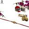 Royal Gold RAKHI with Polished Pearls and Diamonds + Roli & Chaval Royal Gold RAKHI with Polished Pearls and Diamonds + Roli & Chaval
