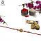Swastika RAKHI W/ Ruby Like Stones & Mahogany Diamonds + Roli & Chaval Swastika RAKHI W/ Ruby Like Stones & Mahogany Diamonds + Roli & Chaval