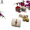 Beautiful Flower Rakhi W/ an embedded Emerald like Pearls + Roli & Chaval Beautiful Flower Rakhi W/ an embedded Emerald like Pearls + Roli & Chaval