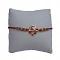 Rose Gold Ganesh Ji RAKHI W/ Red Diamonds + Roli & Chaval 
