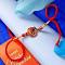 Single Rudraksha Rakhi With Dual-Toned Thread Single Rudraksha Rakhi With Dual-Toned Thread