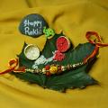 Om Carved RAKHI With Beads and Unique Design + Roli & Chaval Om Carved RAKHI With Beads and Unique Design + Roli & Chaval