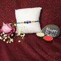 Beautiful Evil Eye Rakhi With Delicate Beads and Roli + Chaval Beautiful Evil Eye Rakhi With Delicate Beads and Roli + Chaval