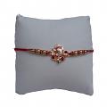 Rose Gold Ganesh Ji RAKHI W/ Red Diamonds + Roli & Chaval 