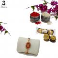 Ruby rakhi Embraced W/ White Diamonds and Ornaments + Roli & Chaval Ruby rakhi Embraced W/ White Diamonds and Ornaments + Roli & Chaval