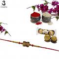 Antique Rakhi in Gold Surrounded W/ red beads and pearls + Roli & Chaval Antique Rakhi in Gold Surrounded W/ red beads and pearls + Roli & Chaval