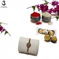 Delicate Swastika Rakhi with Ruby and Royal Embellishment + Roli & Chaval