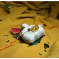 Beautiful Golden Gini Rakhi With Tiny White Beads + Roli & Chaval