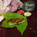 Traditional RAKHI Crafted W/ Rudraksha and beautiful Beads + Roli & Chaval Traditional RAKHI Crafted W/ Rudraksha and beautiful Beads + Roli & Chaval