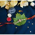 Delicate Kundan Rakhi With White Pearls + Roli & Chaval