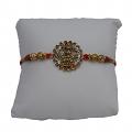 Golden Laxmi Rakhi Adorned with White Diamonds+ Roli & Chaval 