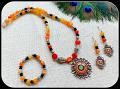 Orange Floral pendant, Earrings and Stretchable Bracelet!!!