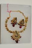 Red, Green, White Stone Studded Golden Color Necklace Set Red, Green, White Stone Studded Golden Color Necklace Set