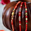 Three Charming Red Beaded Rakhi Bracelets Three Charming Red Beaded Rakhi Bracelets