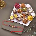 Alluring Krishna Rakhi with 12 pcs. Premium Assorted Sweets Alluring Krishna Rakhi with 12 pcs. Premium Assorted Sweets