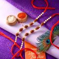 3 Rudraksha Seeds Rakhi With Small Golden Beads – Pack of 2 3 Rudraksha Seeds Rakhi With Small Golden Beads – Pack of 2