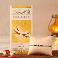 Rakhi w/ Lindt White Coconut Chocolate Bar & Roli-Chawal Kit Rakhi w/ Lindt White Coconut Chocolate Bar & Roli-Chawal Kit