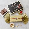 Stylish Cz Rakhi w/ A Box of Lindt Chocolates & Roli-Chawal Kit Stylish Cz Rakhi w/ A Box of Lindt Chocolates & Roli-Chawal Kit