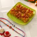 Beads Work Rakhi w/ Indian Mithai Gift Hamper Beads Work Rakhi w/ Indian Mithai Gift Hamper