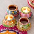 Set of 8 Orange & Blue Painted Clay Diyas for Diwali Decor & Gift Set of 8 Orange & Blue Painted Clay Diyas for Diwali Decor & Gift