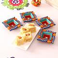 Set of 4 Swastik Shaped Colorful Clay Diyas w/ Soan Papdi