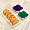 Tempting Holi Gift - Badam Gujiya Box w/ Green & Purple Gulaal Pack Tempting Holi Gift - Badam Gujiya Box w/ Green & Purple Gulaal Pack